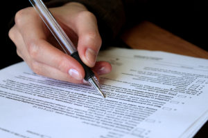 Woman signing will document